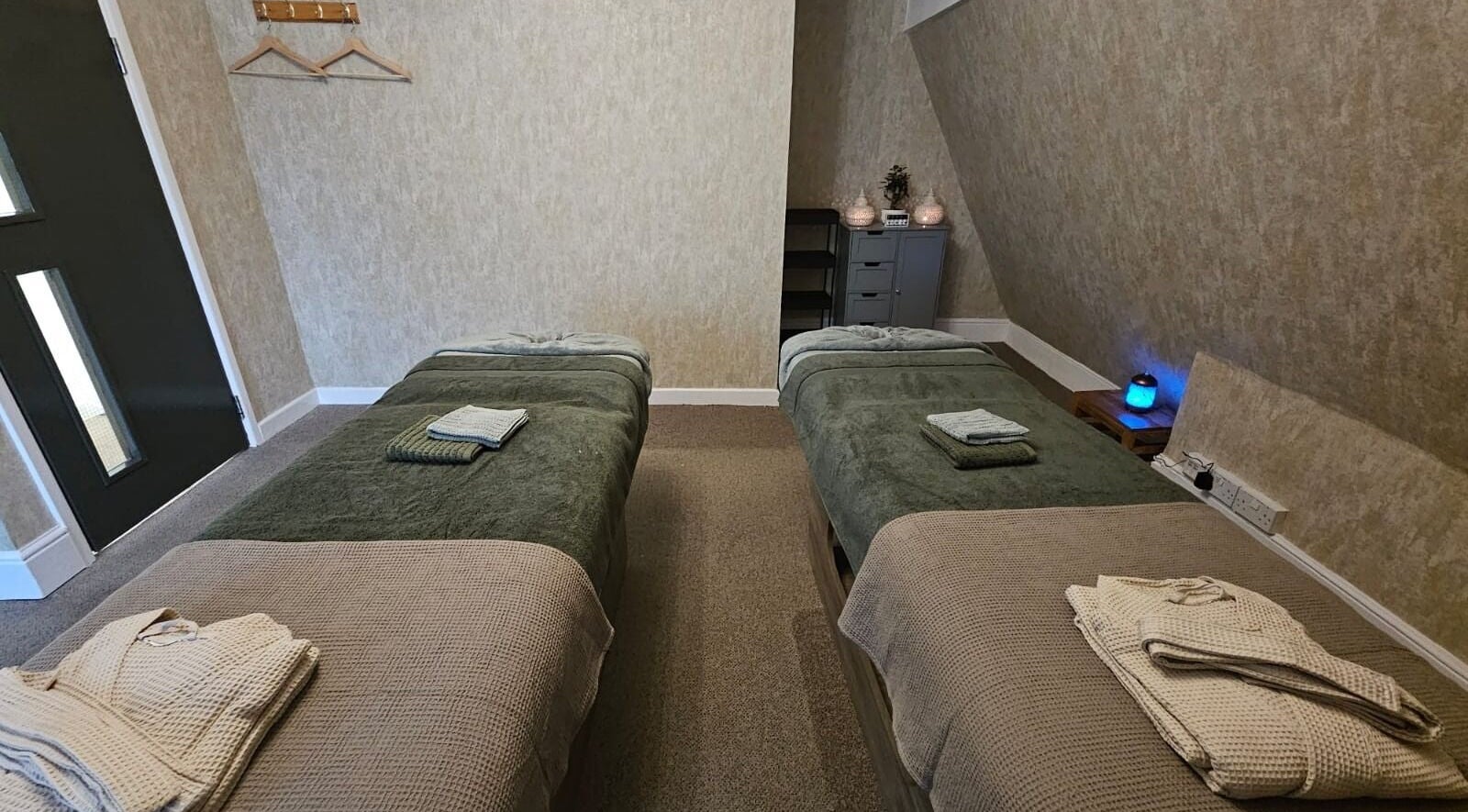 Relaxation room with twin massage beds at Chatchaya Spa, Penarth, Wales, GB.