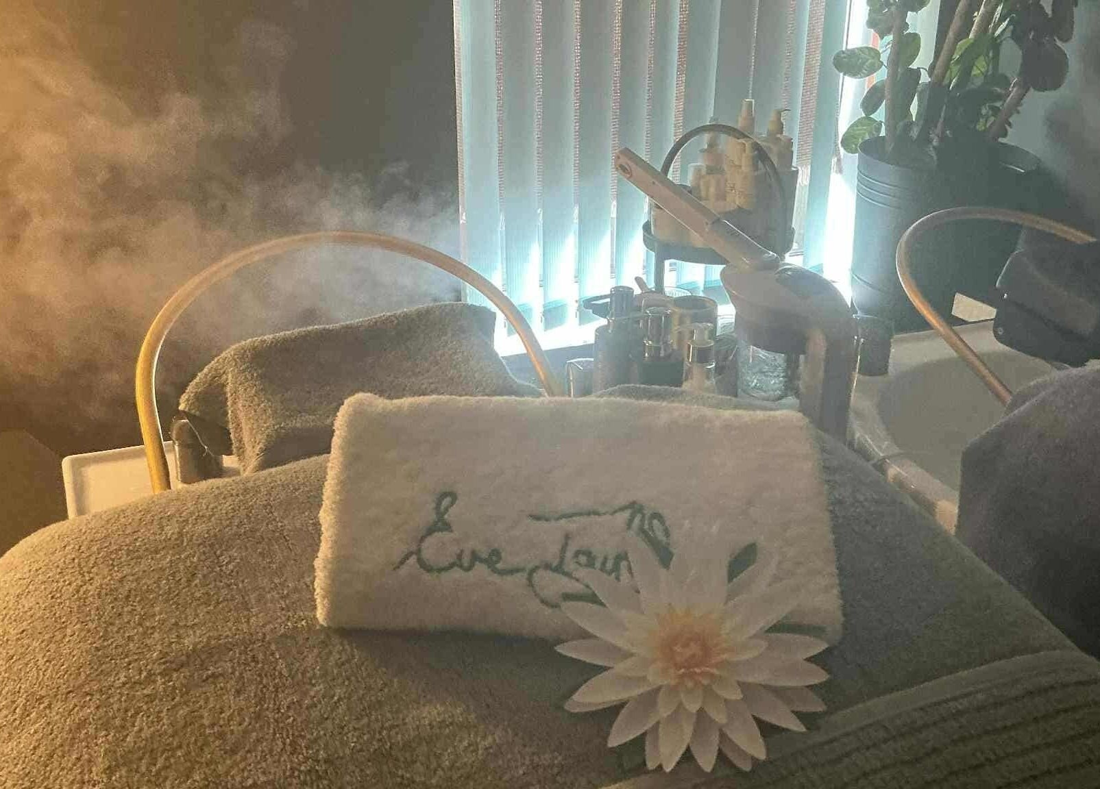 Serene spa setup at Chatchaya Spa in Penarth, Wales, GB, featuring plush towels and a calming ambiance.