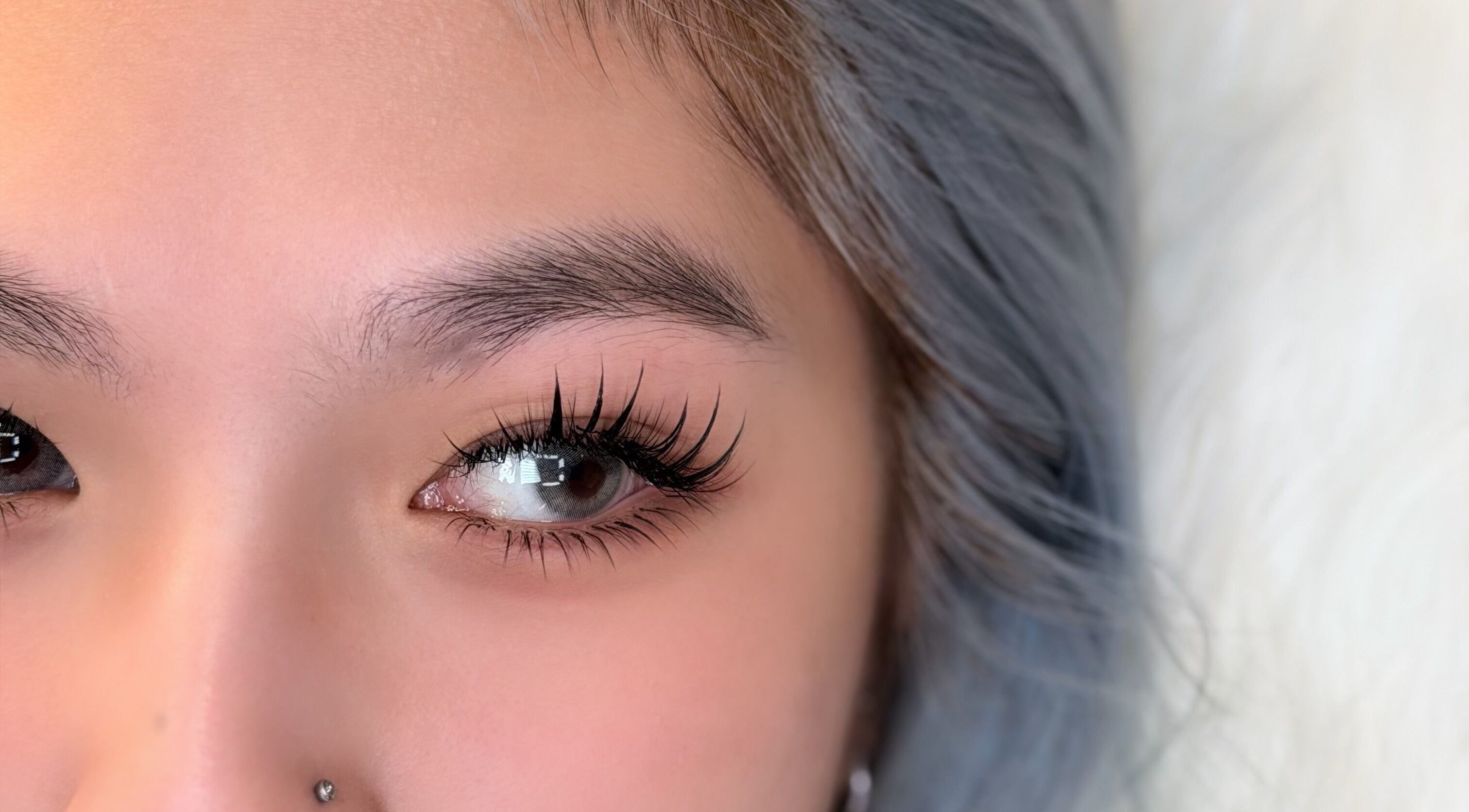 Close-up of styled eyelashes at Blinky Lash in Calgary, Alberta, CA showcasing expertise and elegance.