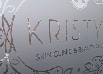 Elegant signage of Kristys Beauty Whitby, located in Whitby, England, GB, with decorative floral patterns.