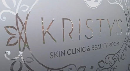 Elegant signage of Kristys Beauty Whitby, located in Whitby, England, GB, with decorative floral patterns.