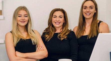Team at Kristys Beauty Whitby in Whitby, England, GB, smiling in black attire, showcasing professionalism.
