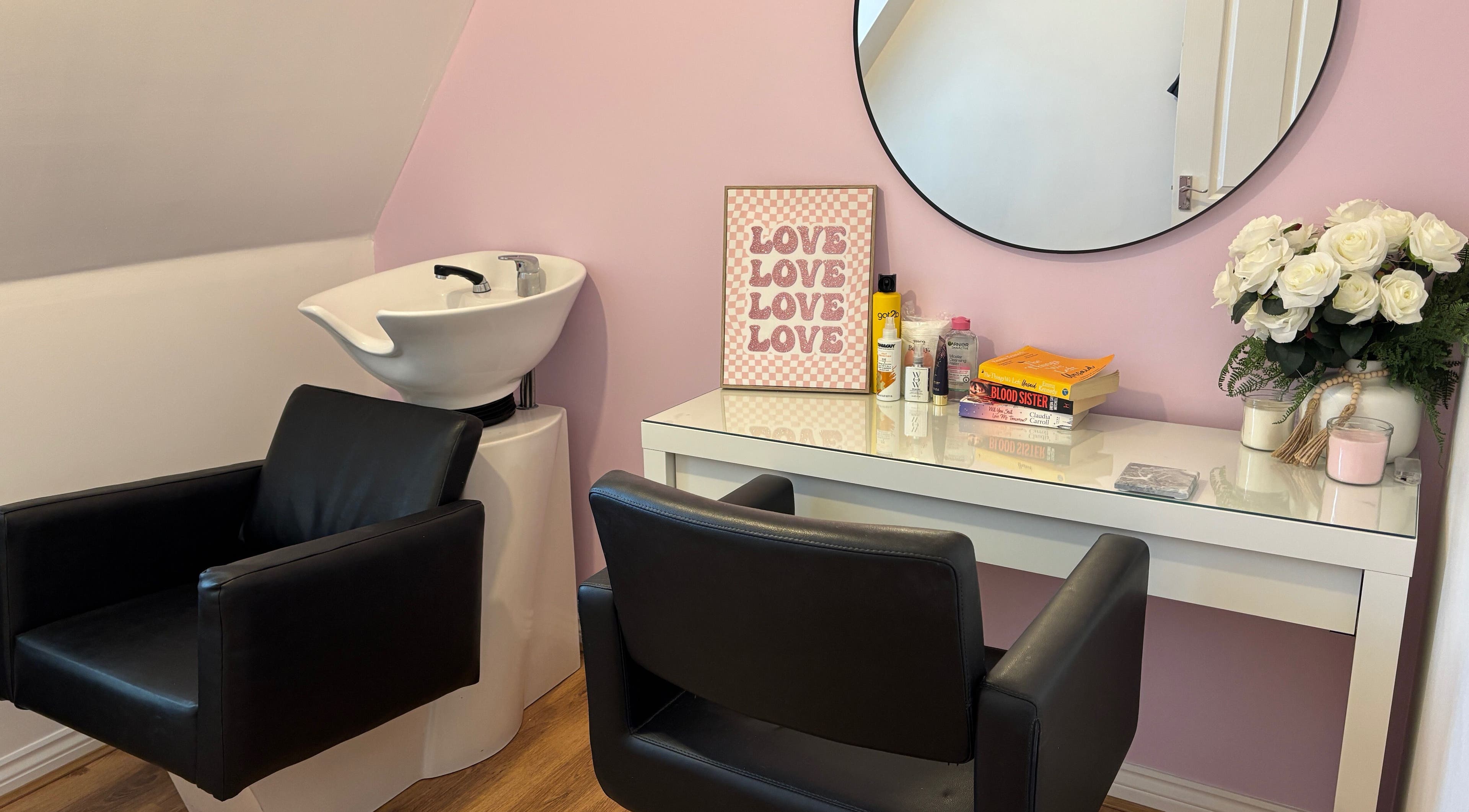Modern salon chair and wash station at Lorna’s Luxe Hair, Great Dunmow, England, GB, with stylish decor.
