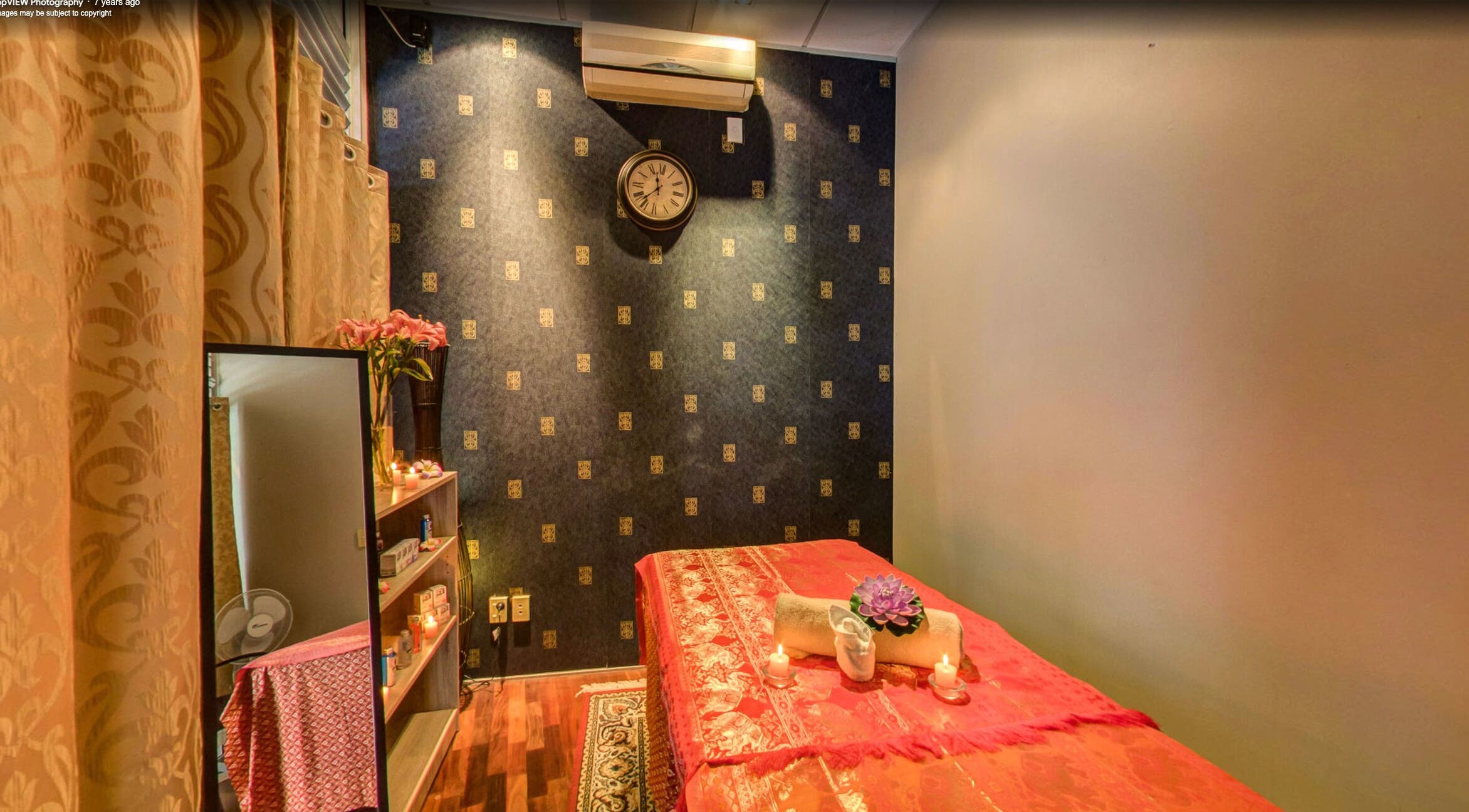 Tranquil massage room at Origin Thai Massage in Auckland, Auckland, NZ, featuring a floral-adorned table.