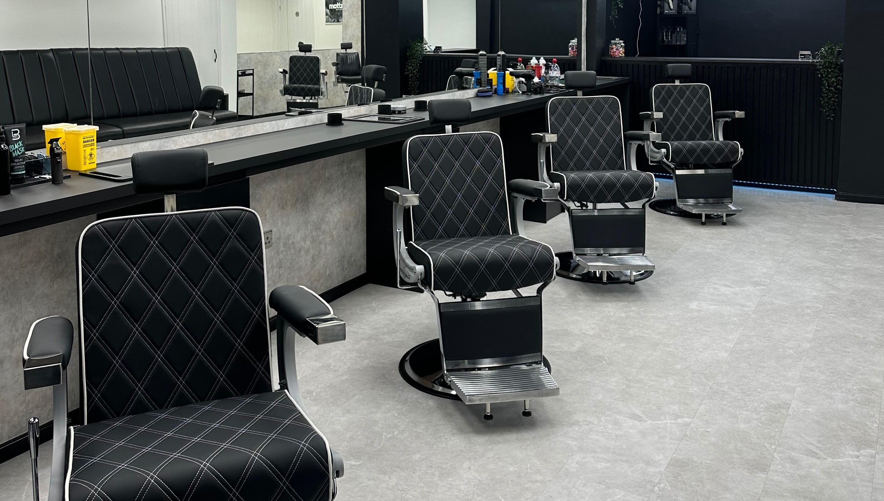 Modern barber chairs at Mattz Barbers in Birmingham, England, GB. Stylish and comfortable grooming space.
