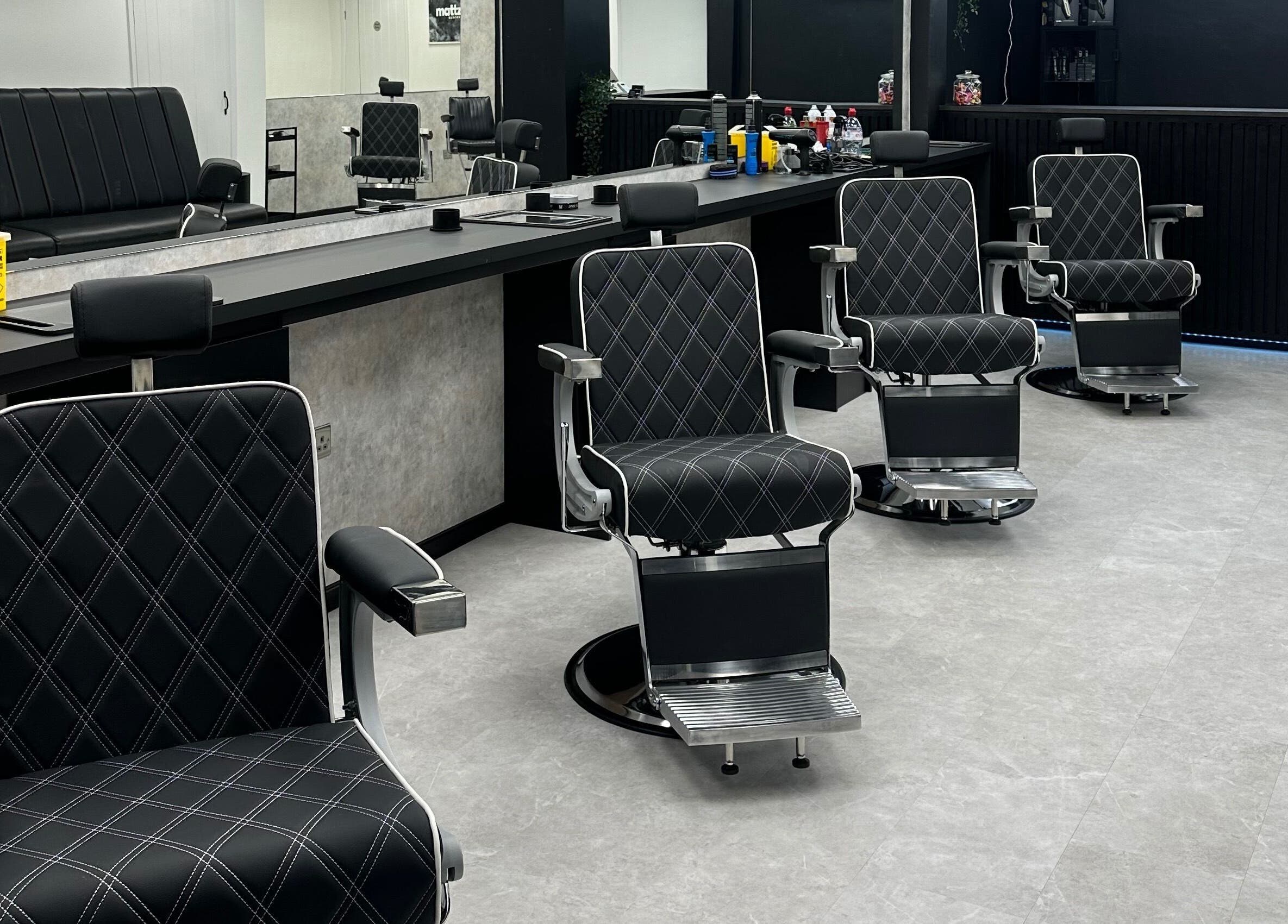 Modern barber chairs at Mattz Barbers in Birmingham, England, GB. Stylish and comfortable grooming space.