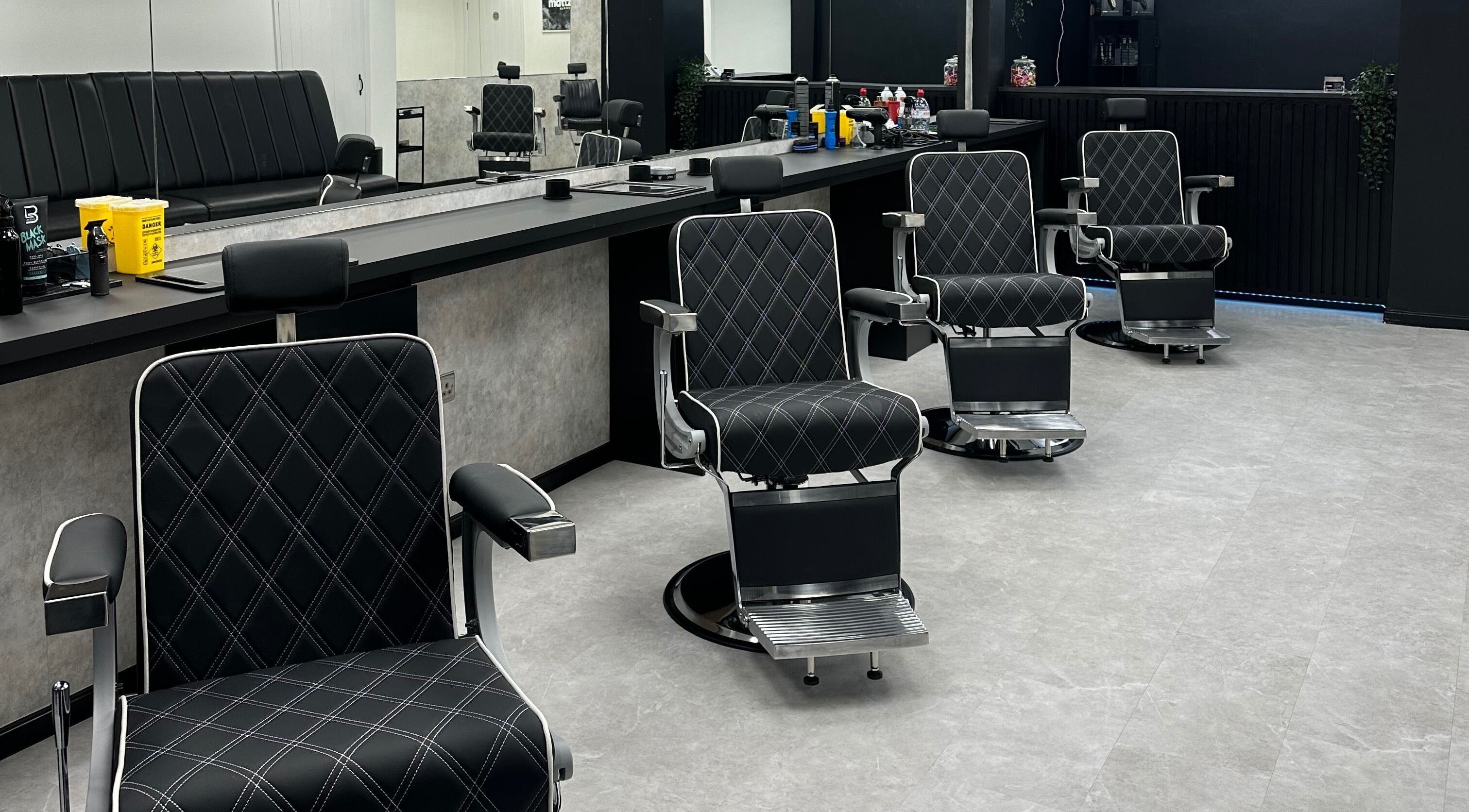 Modern barber chairs at Mattz Barbers in Birmingham, England, GB. Stylish and comfortable grooming space.