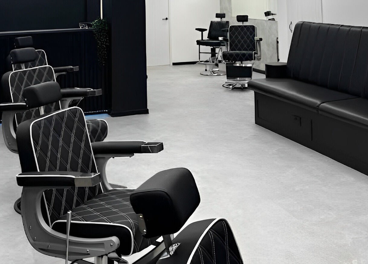 Modern barber chairs at Mattz Barbers, Birmingham, England, GB, showcasing a sleek and stylish interior.