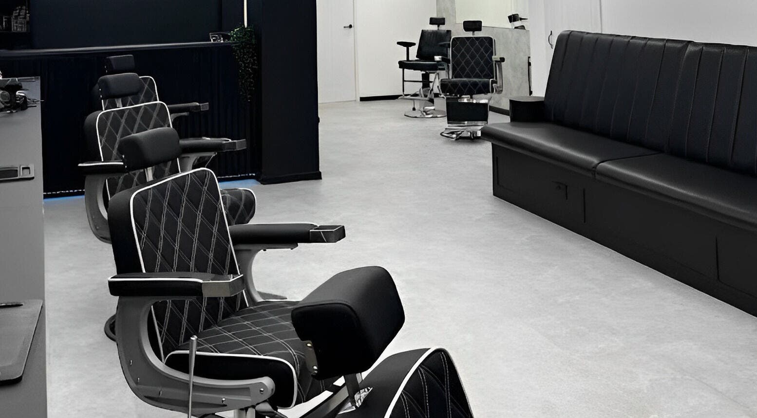 Modern barber chairs at Mattz Barbers, Birmingham, England, GB, showcasing a sleek and stylish interior.