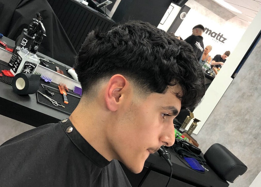 Client showcasing a stylish haircut at Mattz Barbers, Birmingham, England, GB.
