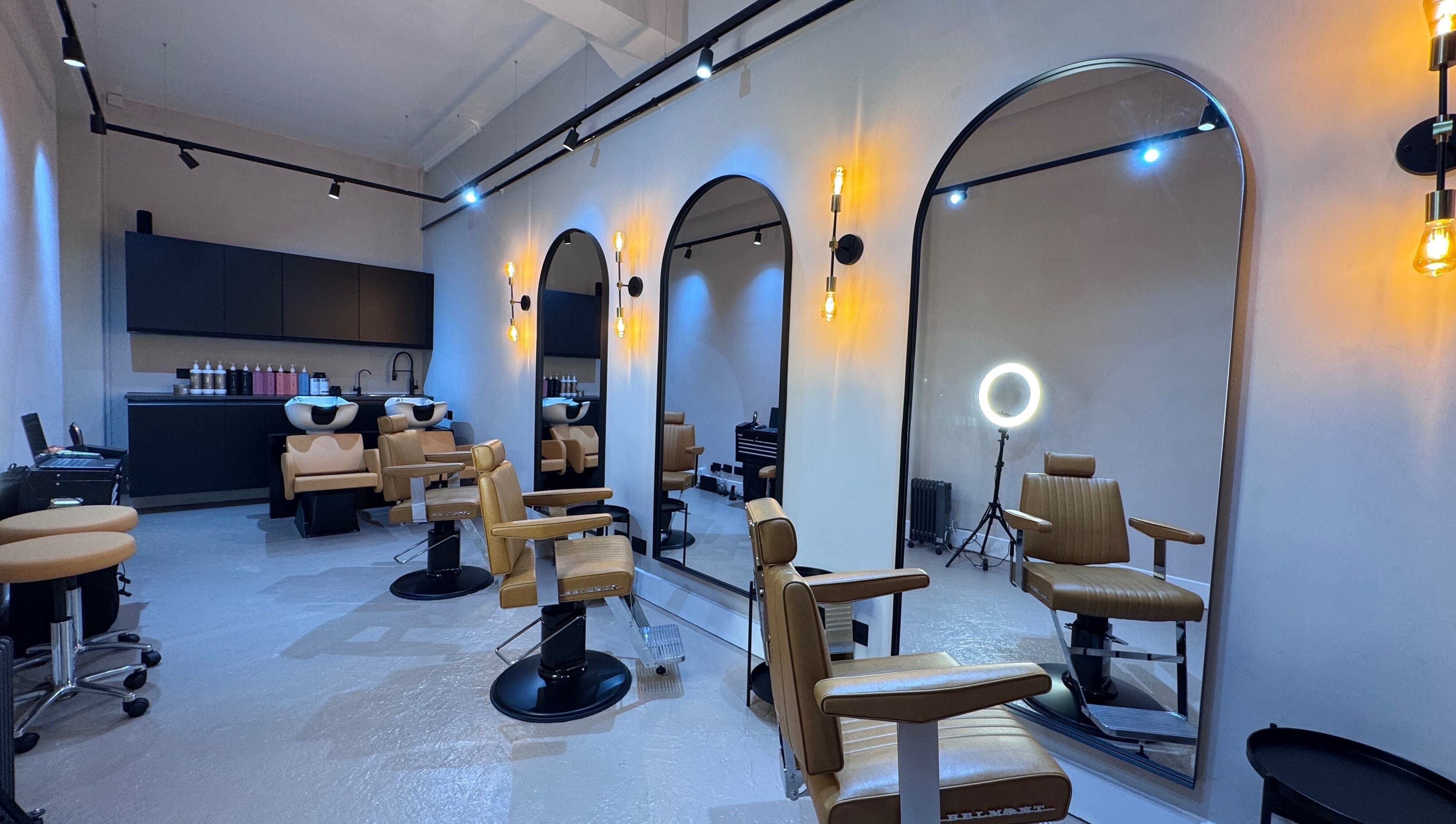 Yss Studio's sleek interior with modern styling chairs in London, England, GB, exuding a luxurious ambiance.