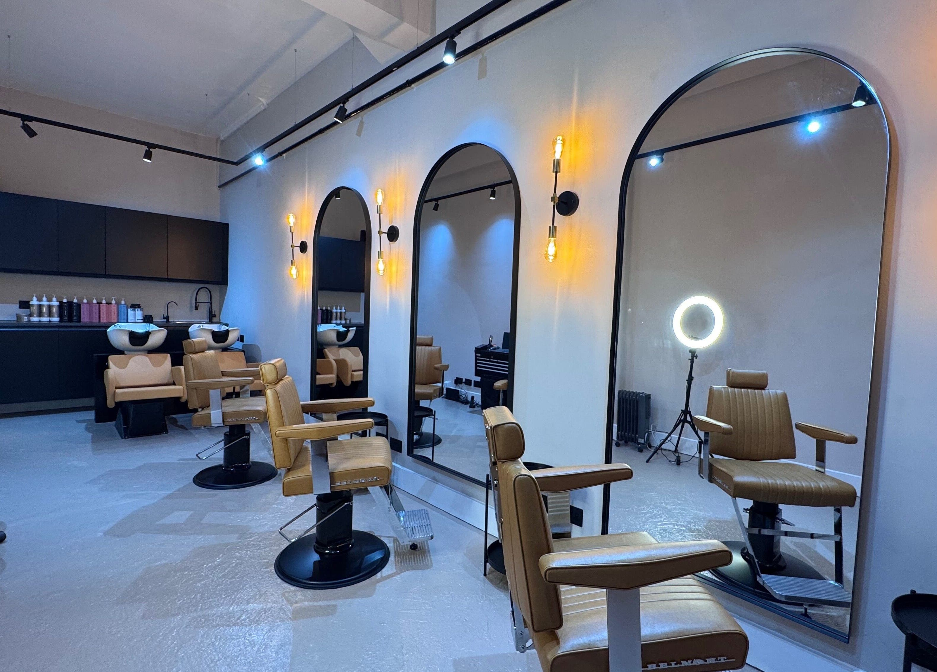 Yss Studio's sleek interior with modern styling chairs in London, England, GB, exuding a luxurious ambiance.