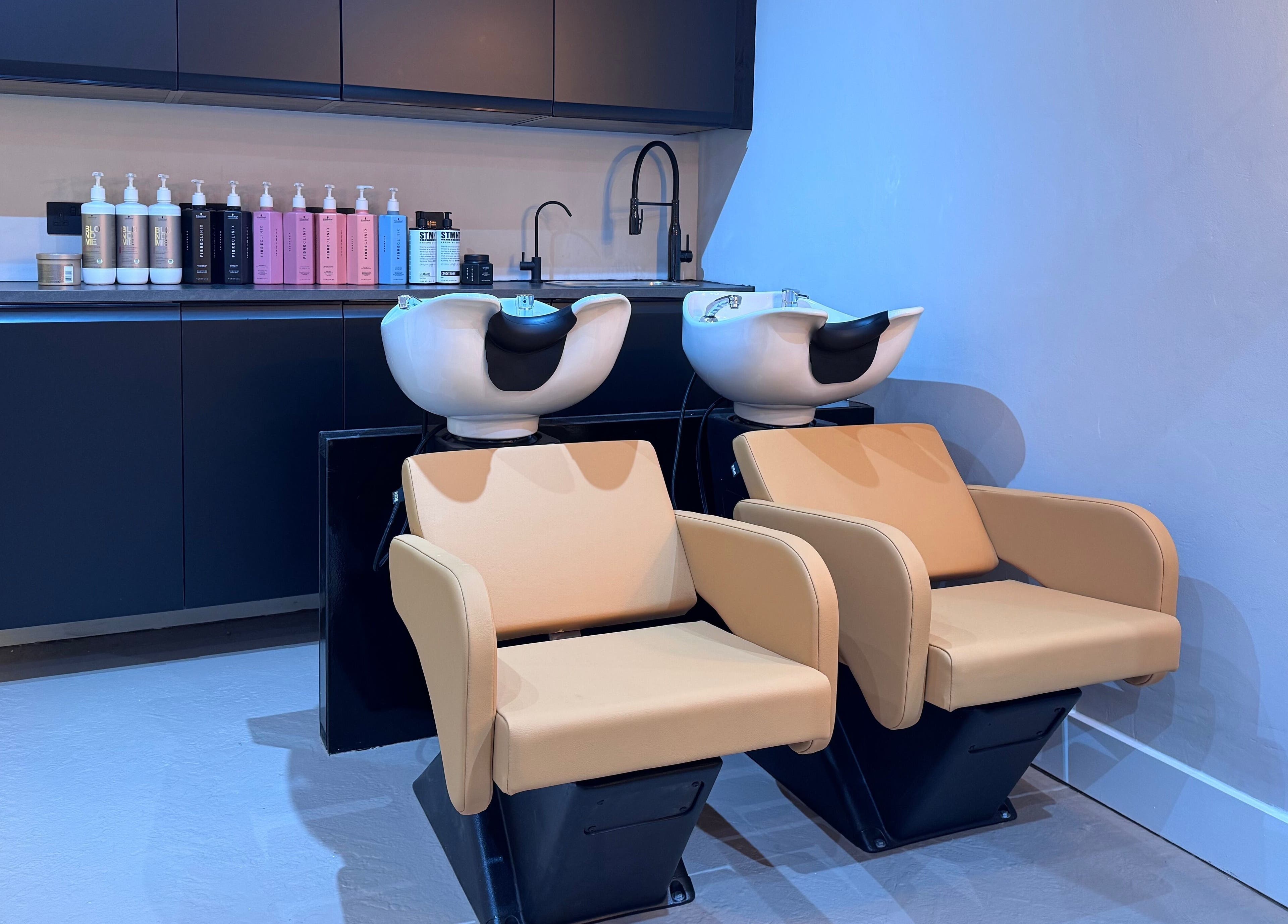 Sleek wash stations at Yss Studio, London, England, GB, enhancing the luxurious beauty experience.
