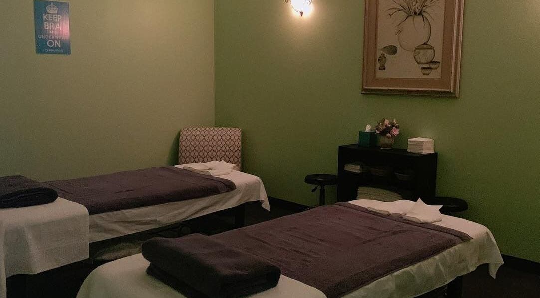 Massage room at Footy Rooty 2 LLC in Edinburg, Texas, US with two treatment beds and relaxing decor.