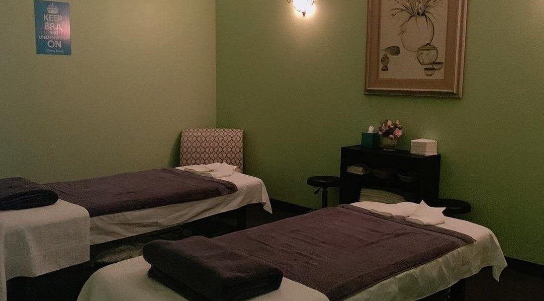 Massage room at Footy Rooty 2 LLC in Edinburg, Texas, US with two treatment beds and relaxing decor.