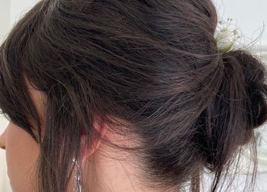 Elegant updo hairstyle by Rita DeSario Make-Up Artist at Southampton, England, GB. Perfect for special occasions.