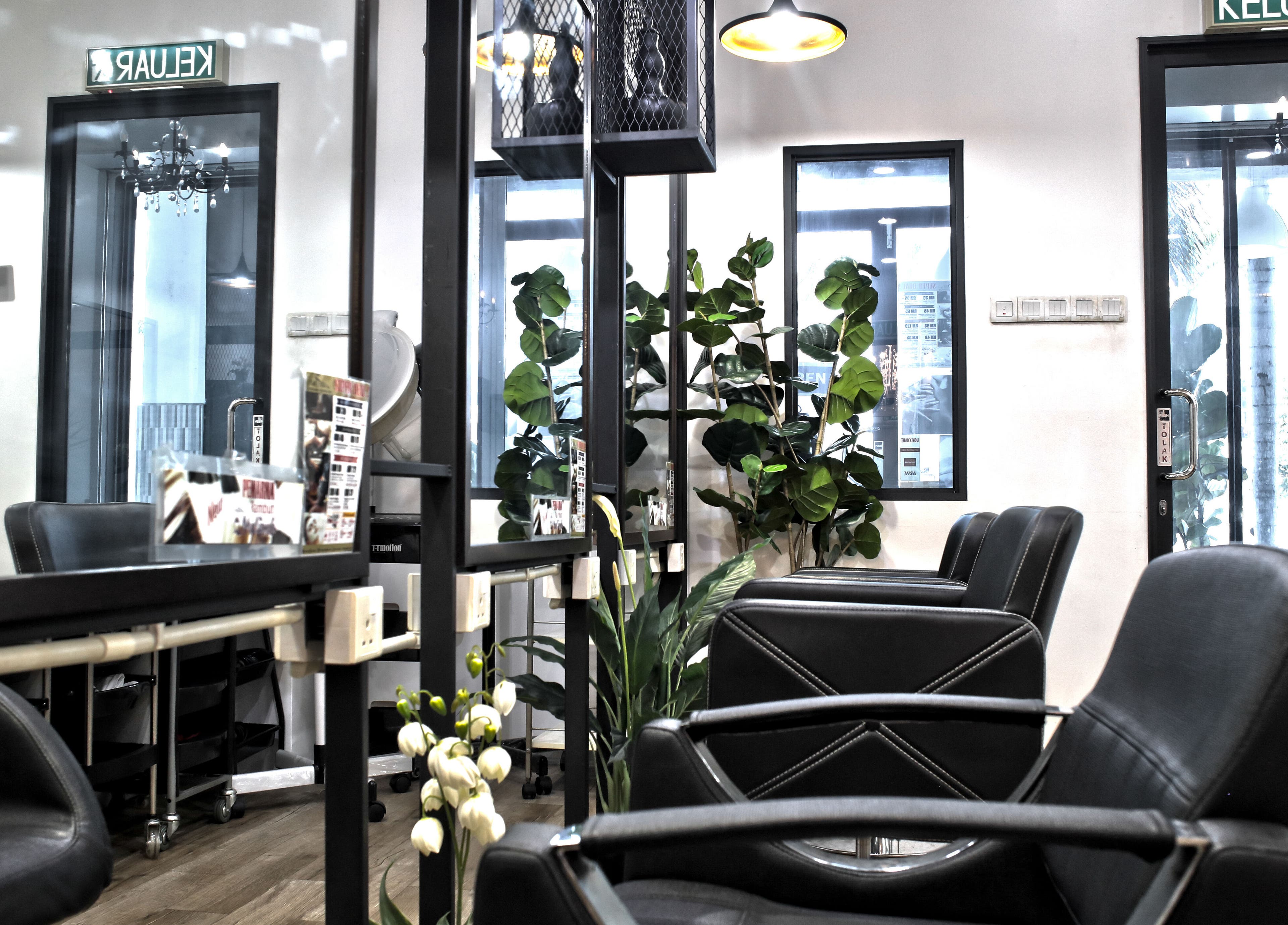 Modern salon interior at Rusilaspa - Laguna SP Kedah, Sungai Petani, Kedah, MY showcasing sleek black chairs.