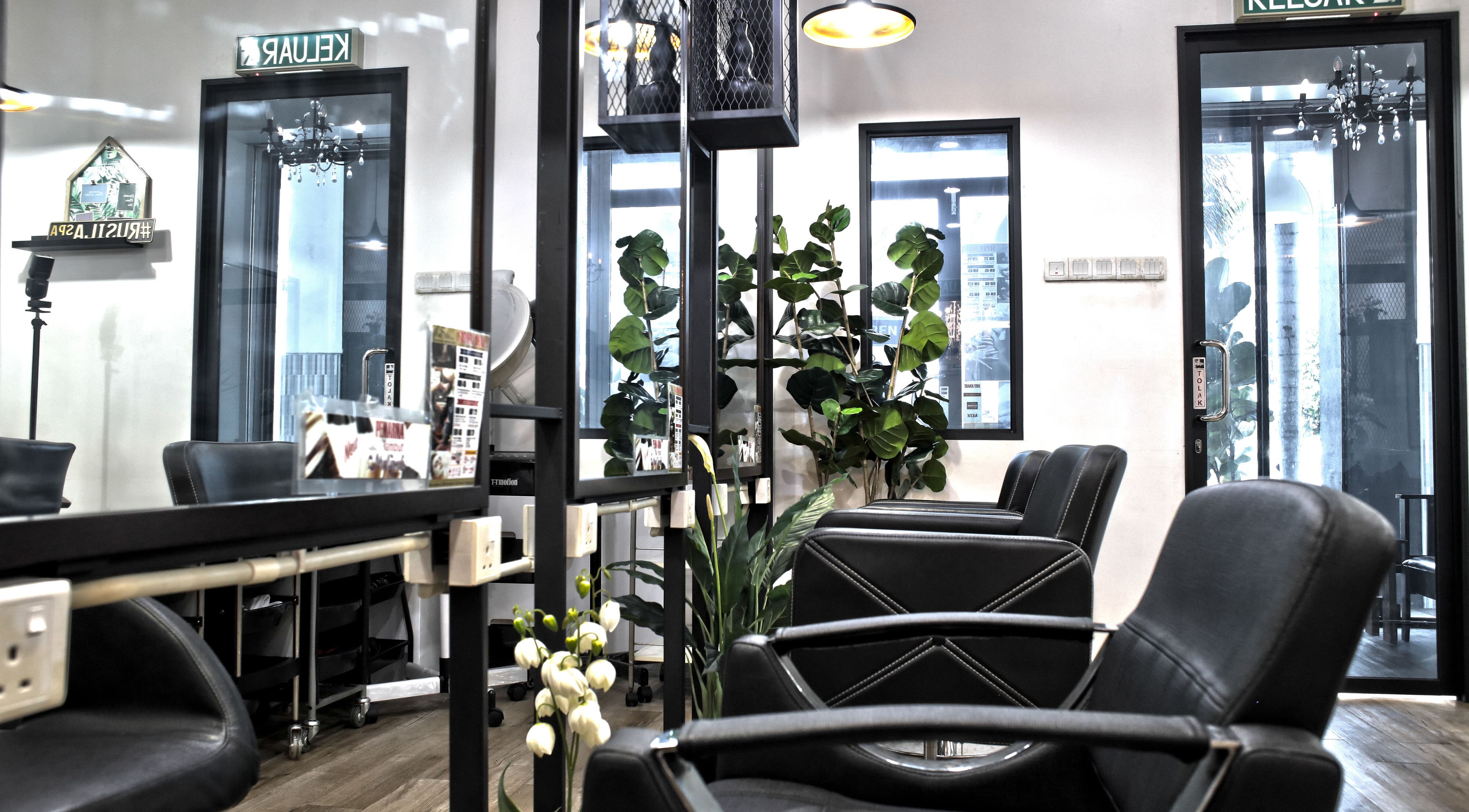 Modern salon interior at Rusilaspa - Laguna SP Kedah, Sungai Petani, Kedah, MY showcasing sleek black chairs.