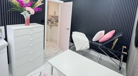 Modern treatment room at Elegant Nails, Cardiff, Wales, GB, featuring a floral decor and sleek furnishings.