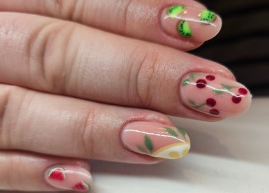 Colorful fruit nail art at Elegant Nails, Cardiff, Wales, GB showcasing kiwi, cherry, and watermelon designs.