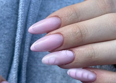 Elegant Nails in Cardiff, Wales, GB showcases perfectly manicured pink acrylic nails.