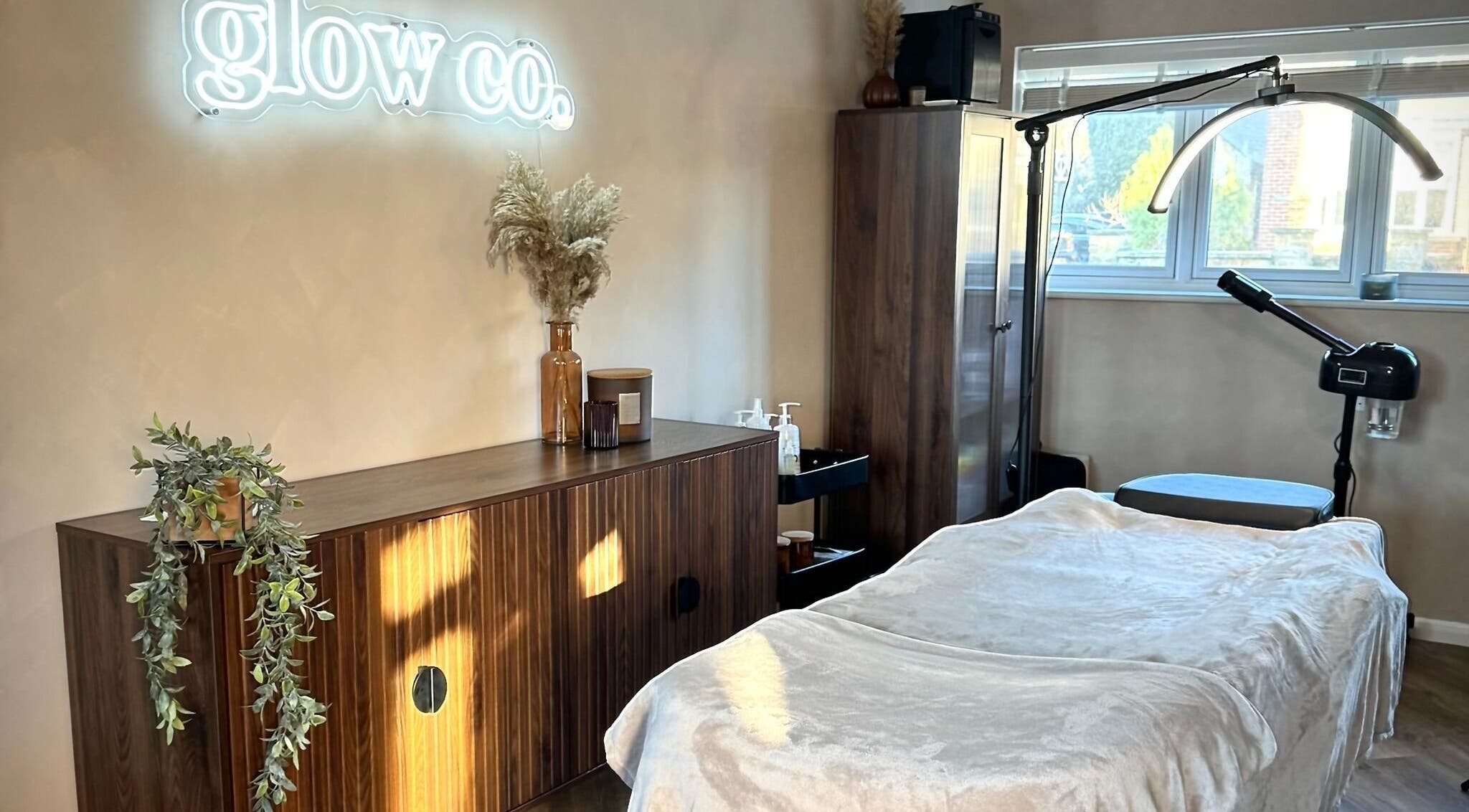 Relaxing treatment room at Glow Co. Skincare, Walgrave, GB with cozy decor and gentle lighting.