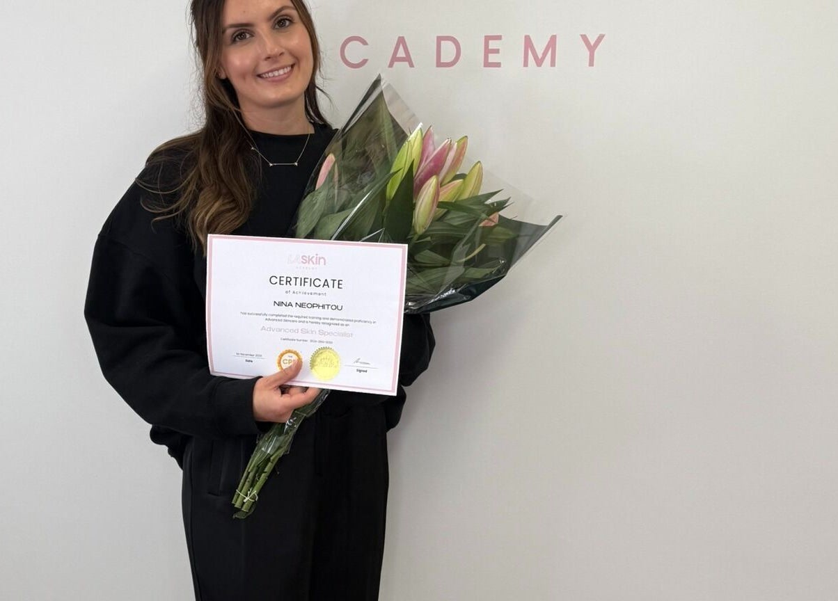 Glow Co. Skincare graduate holding certificate and flowers in Walgrave, GB.