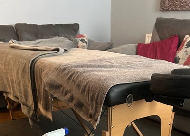 Comfortable massage area at Pollock Sports Therapy in Coleraine, Northern Ireland, GB, with cozy pillows and blankets.