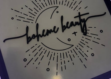 Cosmic-themed sign of Boheme Beauty Nail Salon in Crosby, Texas, US, with crescent moon design.
