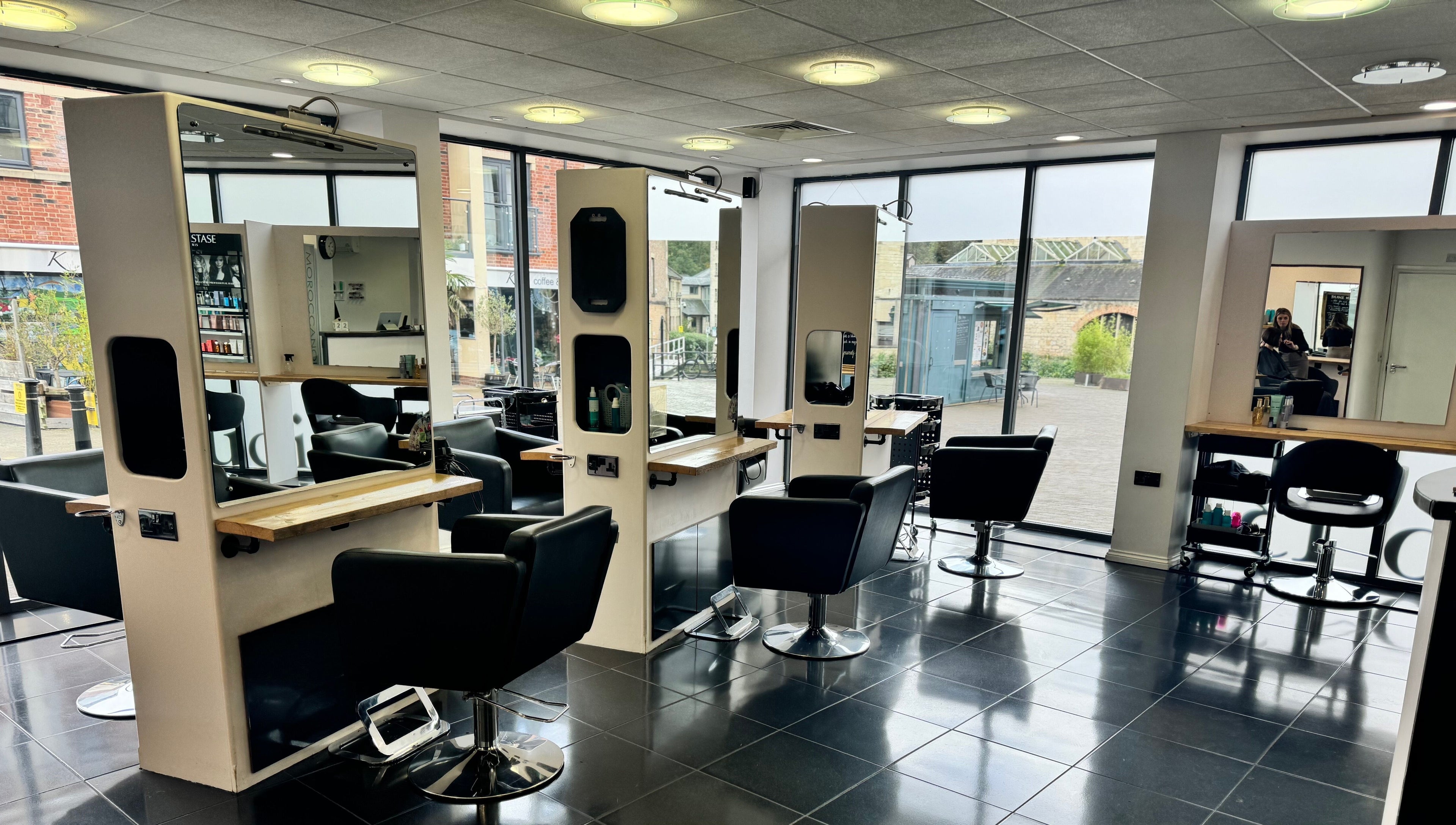 Modern salon chairs and mirrors at Studio 13 “A Salon Collective for Independent Stylists” in Ebley, England, GB.