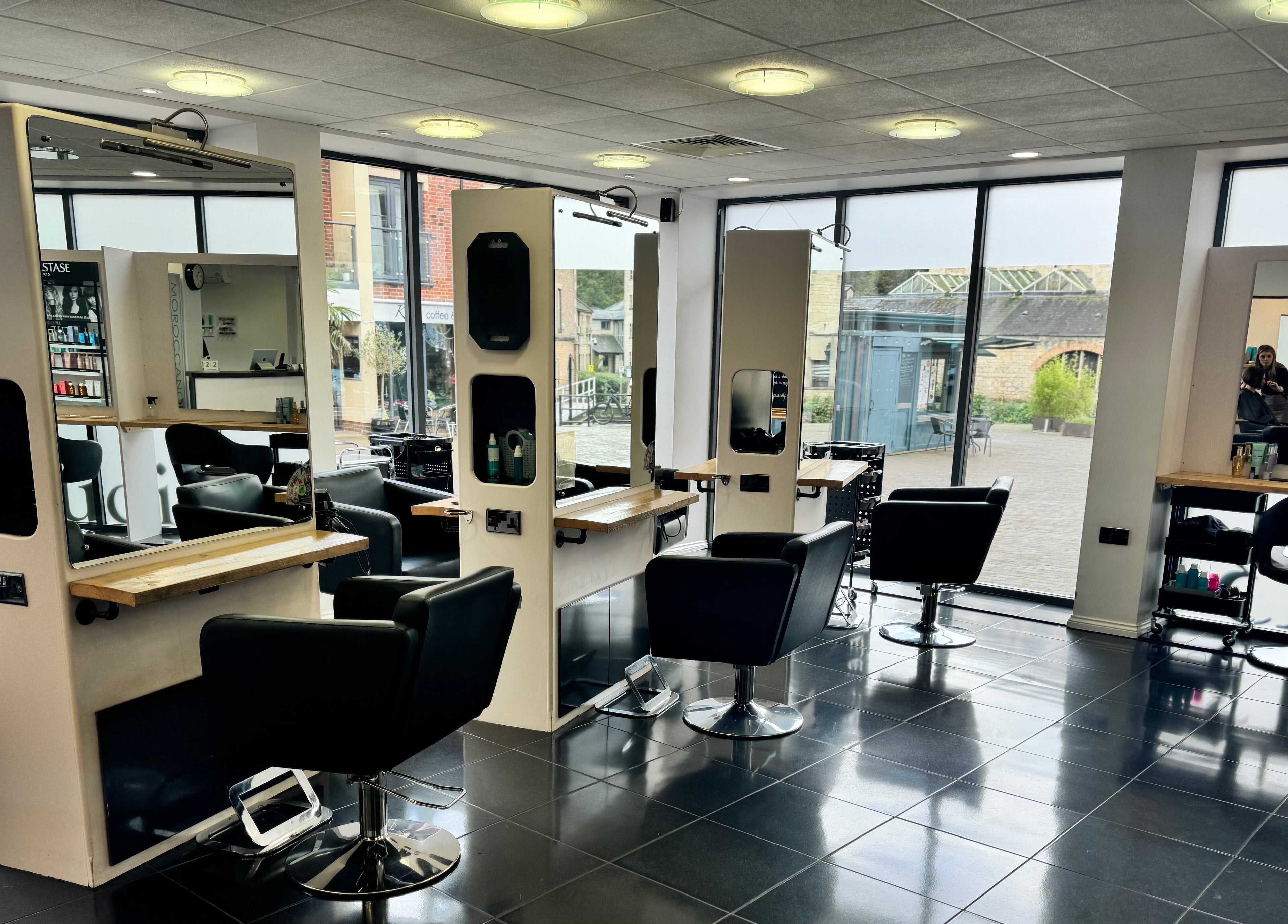 Modern salon chairs and mirrors at Studio 13 “A Salon Collective for Independent Stylists” in Ebley, England, GB.