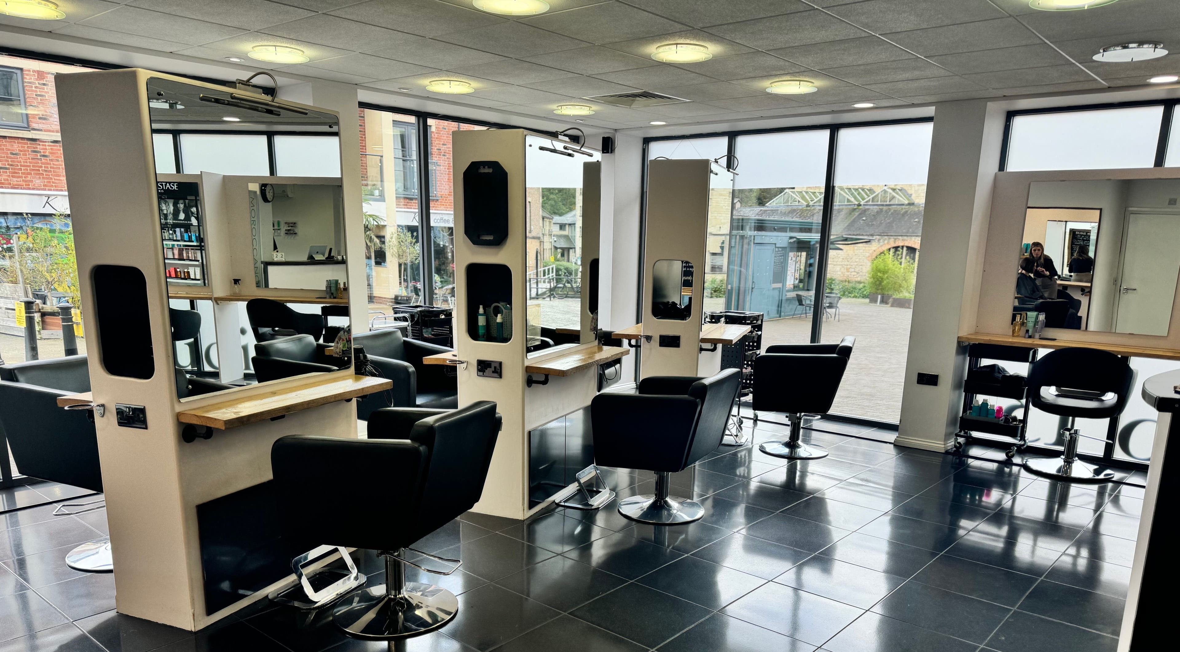 Modern salon chairs and mirrors at Studio 13 “A Salon Collective for Independent Stylists” in Ebley, England, GB.