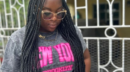 Woman with stylish braids at Loc'd Hause JA, Spanish Town, St. Catherine Parish, JM.