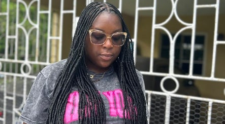 Guest with locs and sunglasses at Loc'd Hause JA, Spanish Town, St. Catherine Parish, JM.