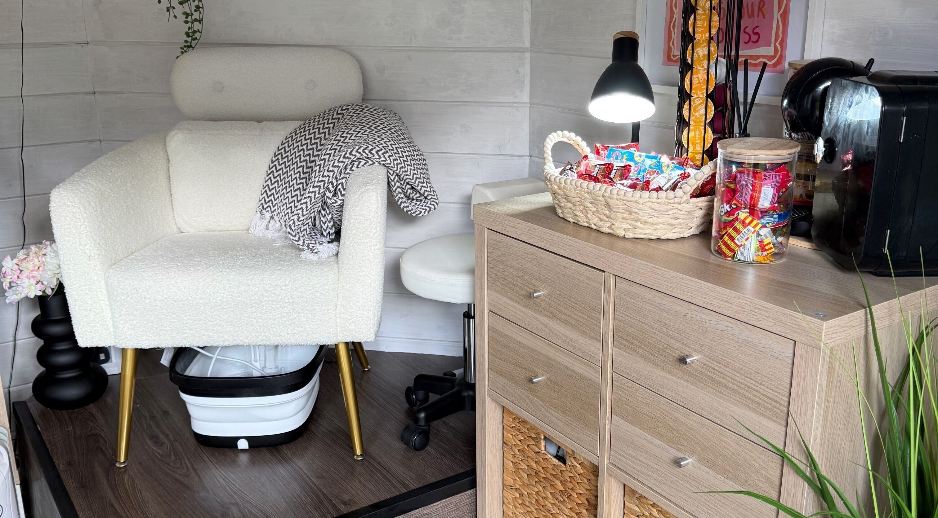 Relaxing interior at Orchard Beauty by Els, Meare, England, GB with plush chair and refreshments.