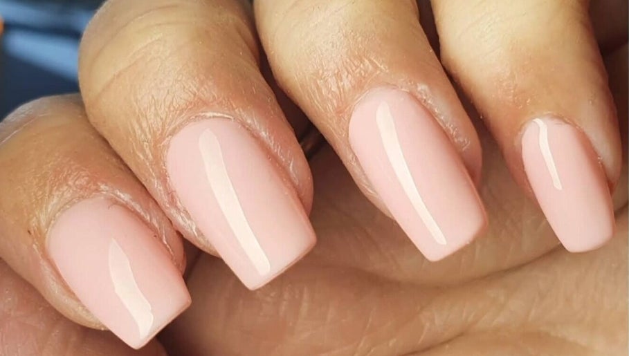 Elegant nude nails with a glossy finish at Polished, Ripley, England, GB.