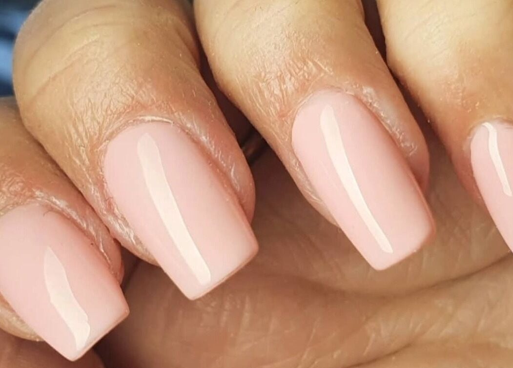 Elegant nude nails with a glossy finish at Polished, Ripley, England, GB.