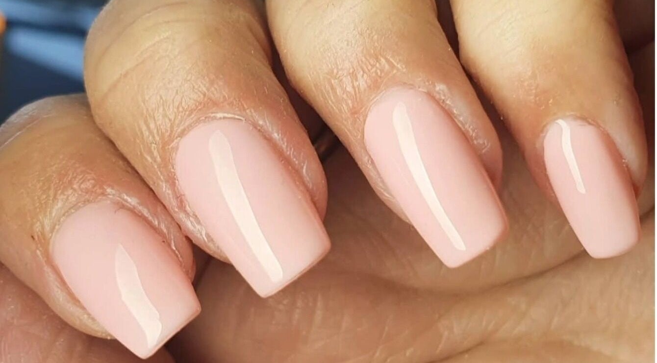 Elegant nude nails with a glossy finish at Polished, Ripley, England, GB.