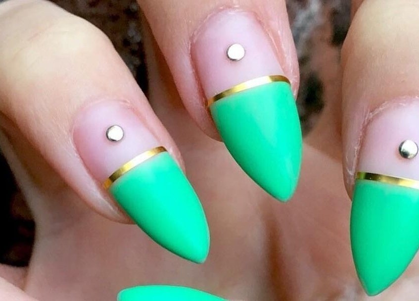 Stunning emerald nail art at Polished, Ripley, England, GB. Features gold accents and rhinestones.