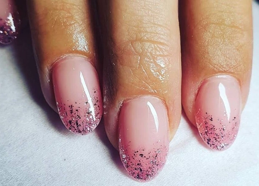 Elegant pink nails with glitter tips at Polished, Ripley, England, GB, showcasing nail artistry.