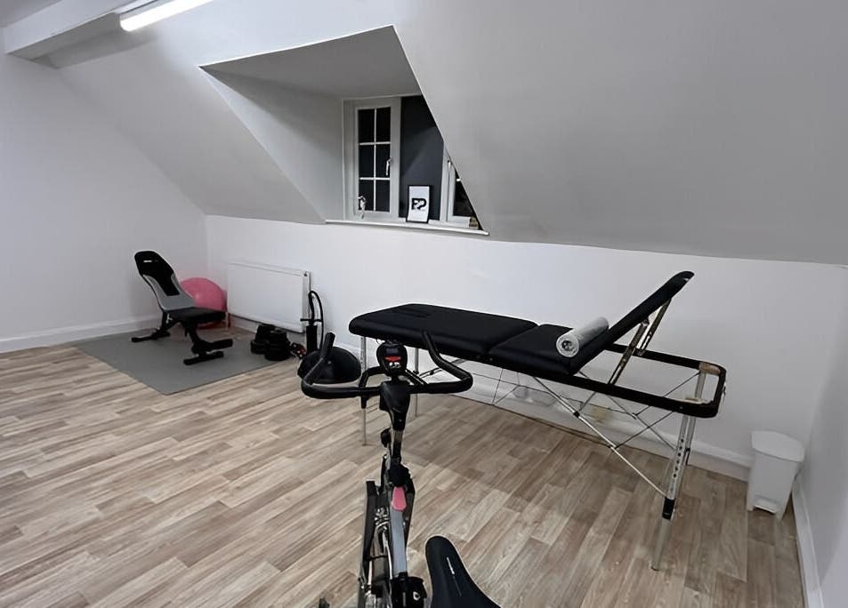 Modern therapy room at First Place Physiotherapy, Fleet, England, GB, with equipment for wellness sessions.