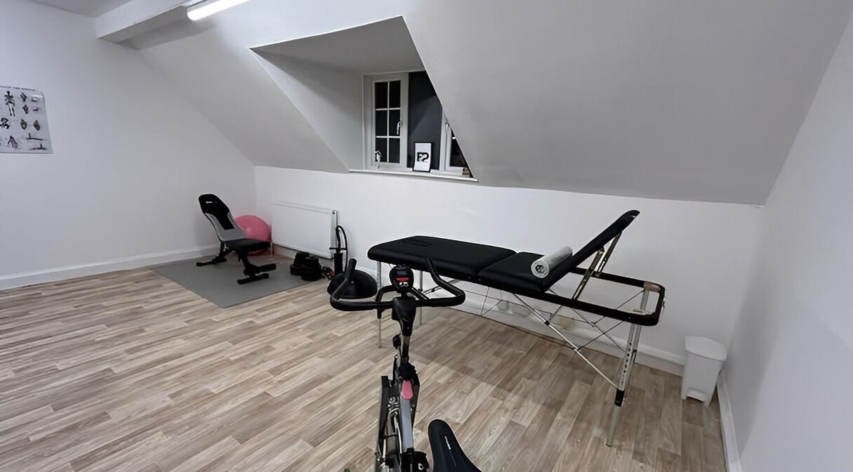Modern therapy room at First Place Physiotherapy, Fleet, England, GB, with equipment for wellness sessions.