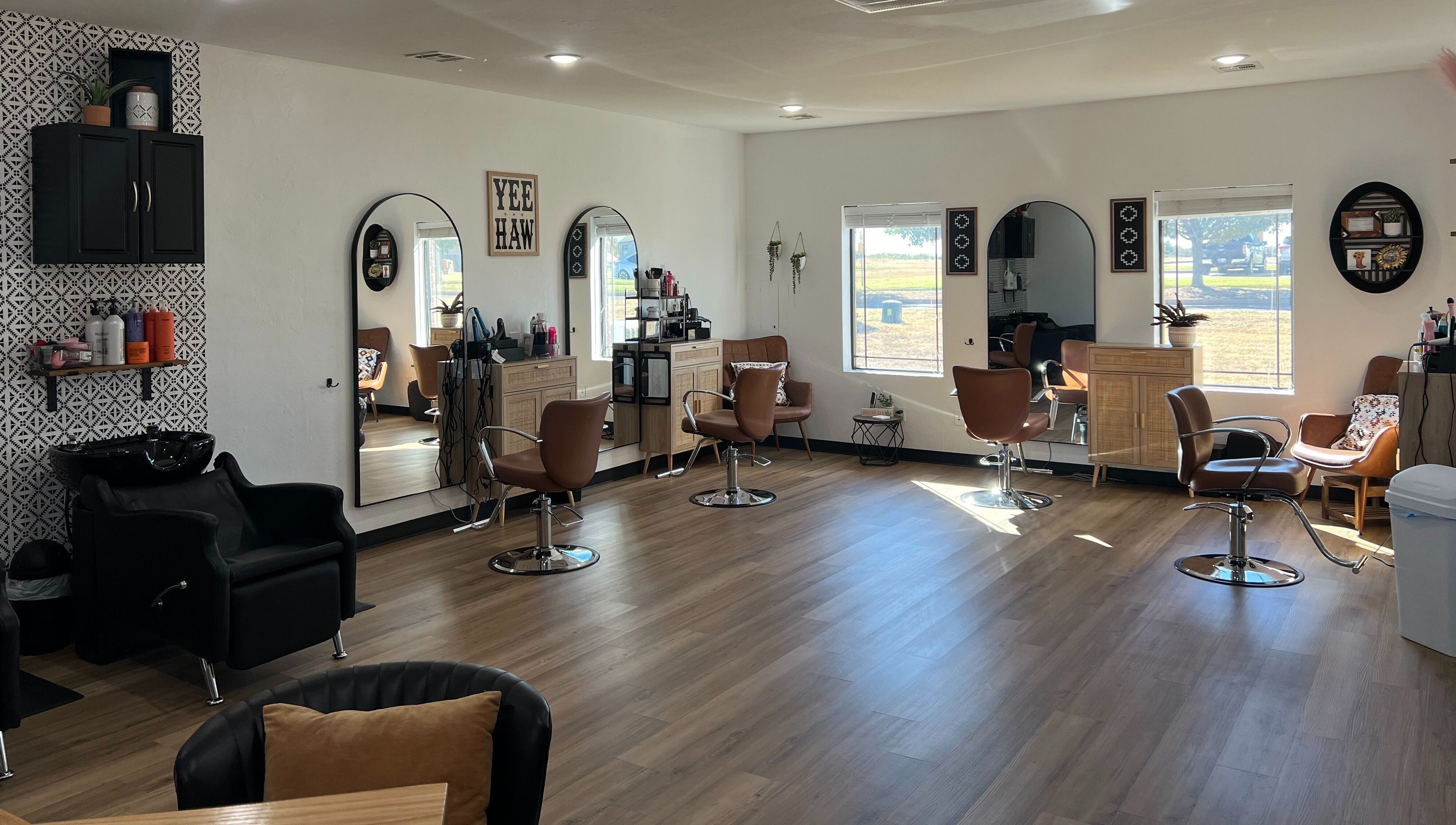 Chic interior of TruRadiance Esthetics salon in Piedmont, Oklahoma, US featuring modern styling chairs and decor.
