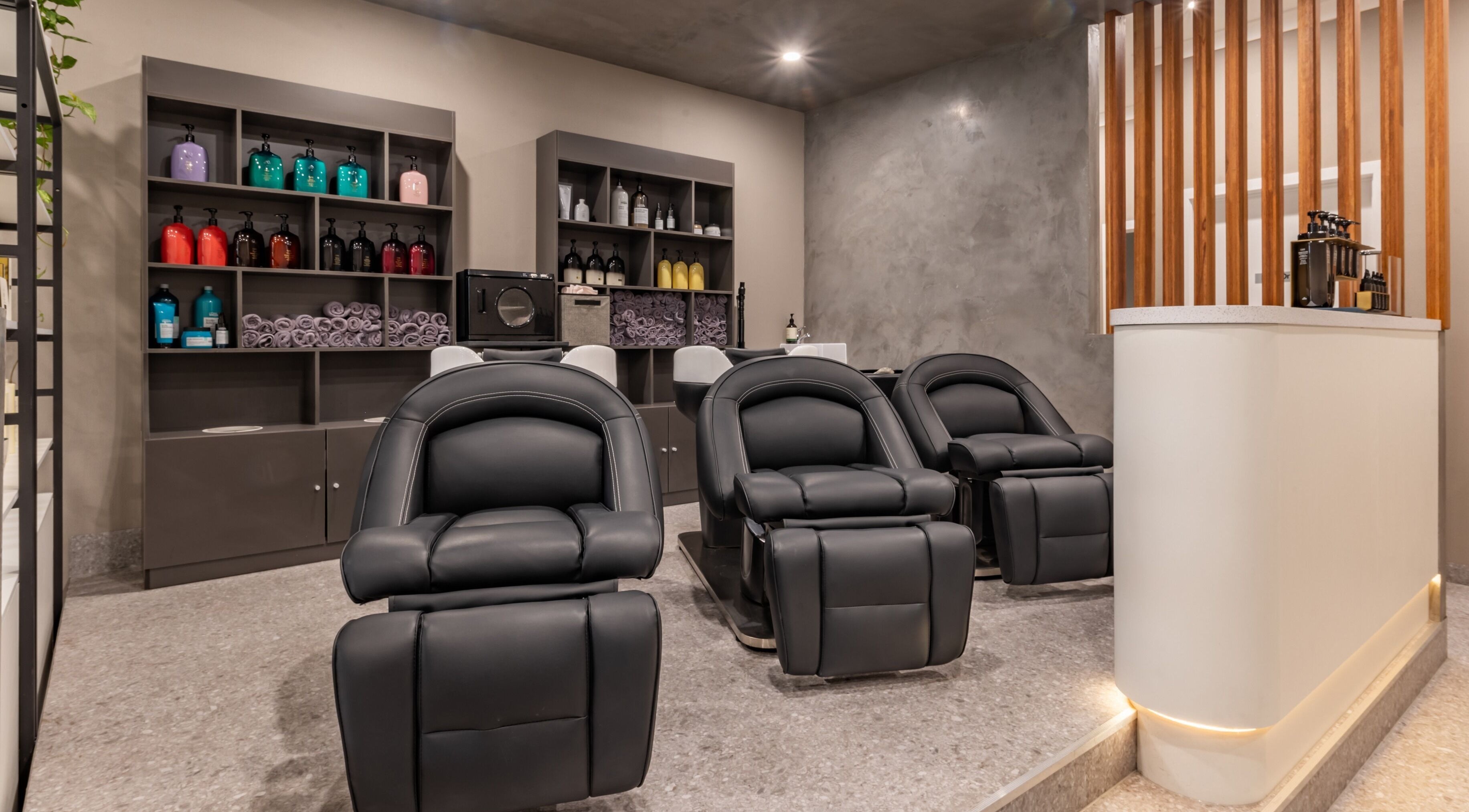 Elegant shampoo chairs at Deevo Hair Salon in Melbourne, Victoria, AU, offering a premium hair care experience.