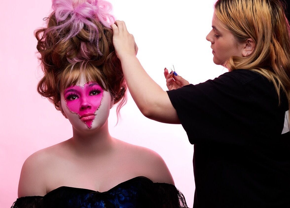 Stylist creating elegant updo with pink makeup theme at HarmonyCrystalHMUA, Morayfield, Queensland, AU.