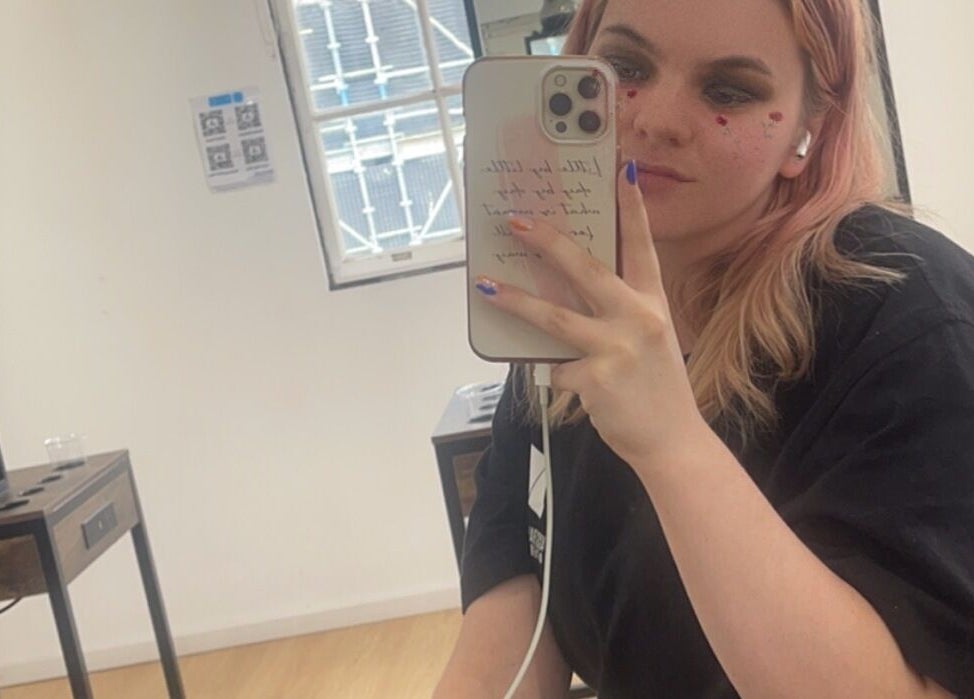 A guest taking a selfie at HarmonyCrystalHMUA in Morayfield, Queensland, AU, showcasing modern salon vibes.