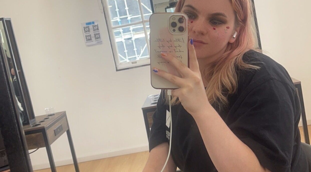 A guest taking a selfie at HarmonyCrystalHMUA in Morayfield, Queensland, AU, showcasing modern salon vibes.