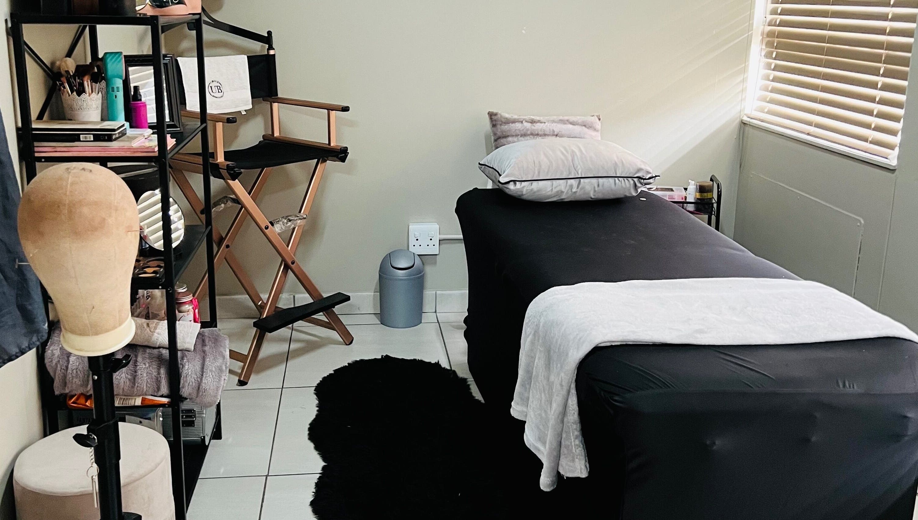Relaxing treatment room at Ubuhle Bebhudango Beauty Studios, Ga-nala, Mpumalanga, ZA with sleek decor.