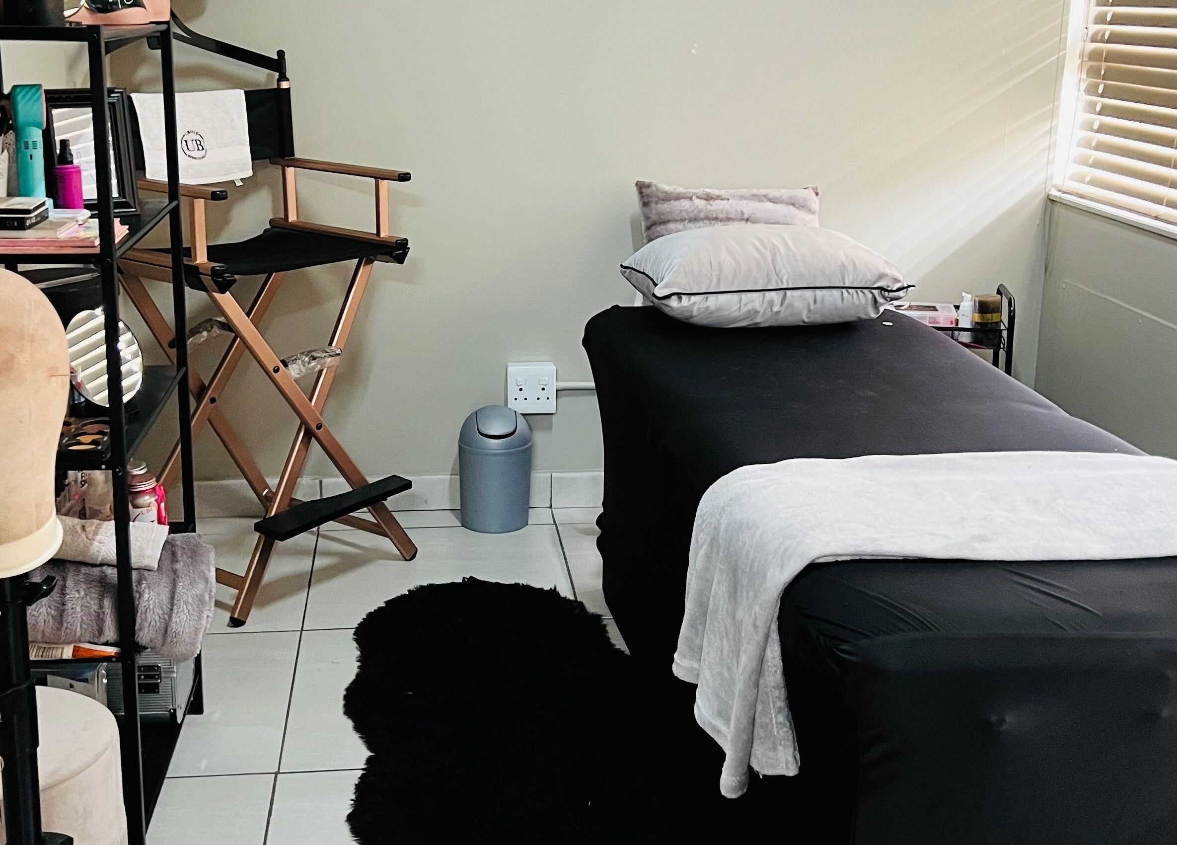 Relaxing treatment room at Ubuhle Bebhudango Beauty Studios, Ga-nala, Mpumalanga, ZA with sleek decor.