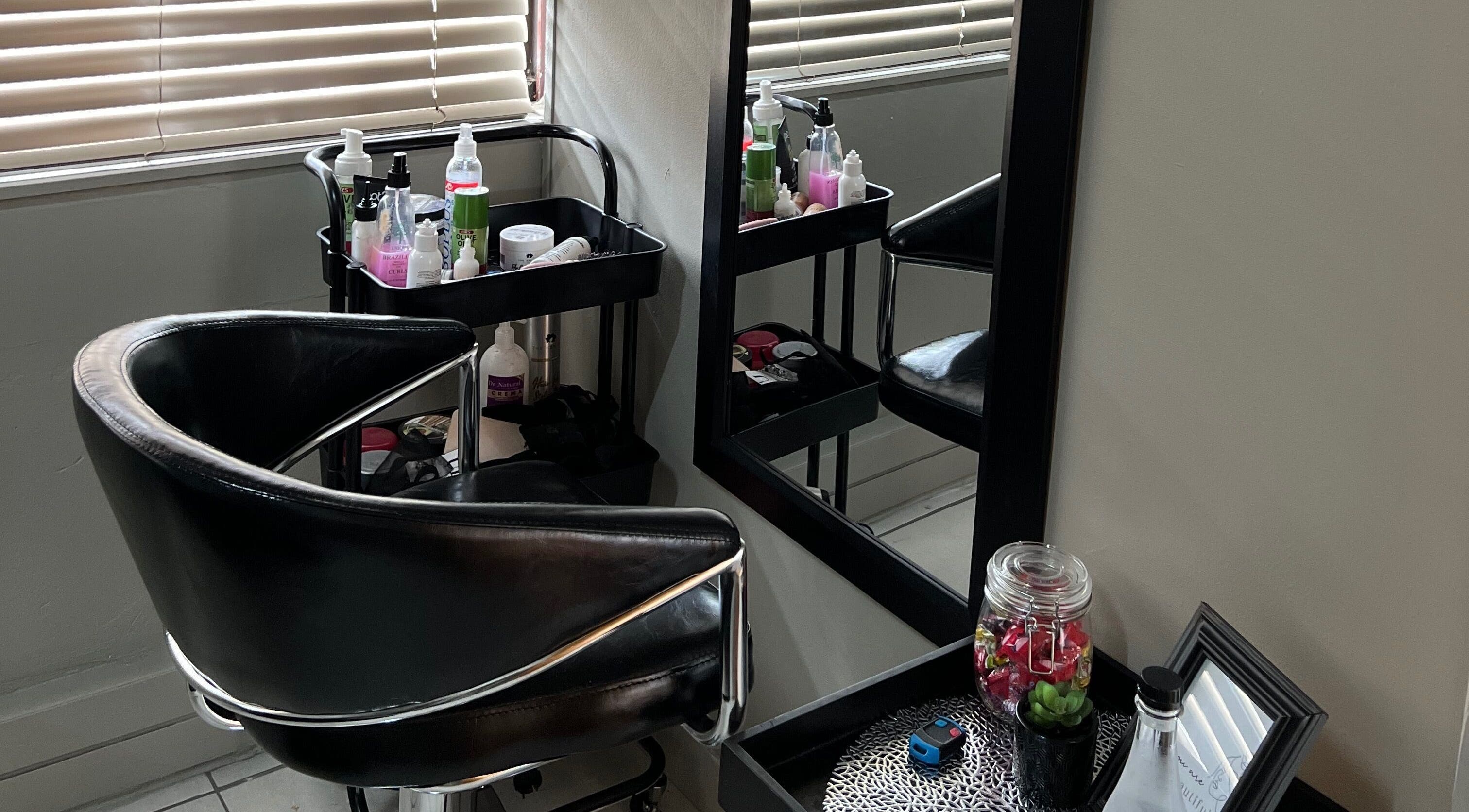 Stylish salon chair and mirror at Ubuhle Bebhudango Beauty Studios, Ga-nala, Mpumalanga, ZA.